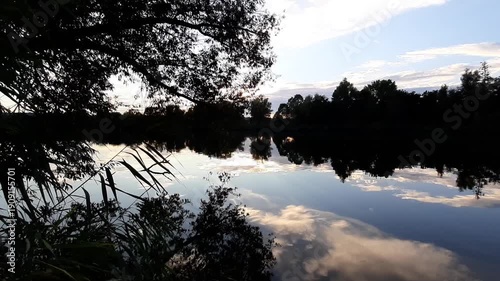 Spring lake landscape trees reflecting in water near Regensburg Germany 