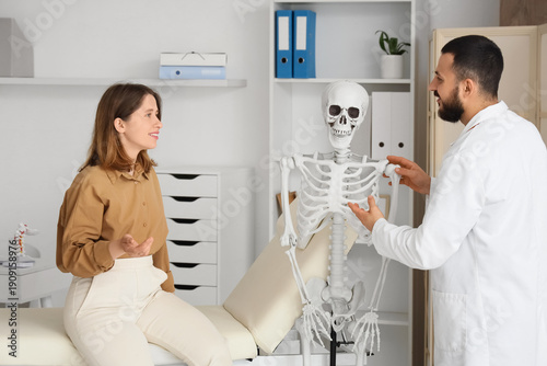 Male doctor showing human s...