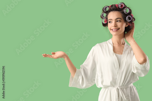 Young woman in robe with ha...