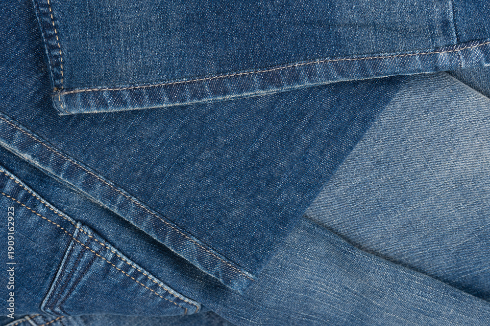 Fototapeta premium Blue jeans denim texture as a background. Top view.