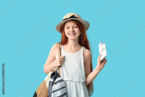 Cute girl with beach bag an...