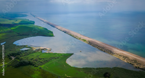 Tableau sur toile Aerial photo of Chesil beach, Dorset, UK, looking East from Abbotsbury towards Portland on a hazy summer day