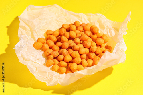 Chilli coated peanuts on ye...