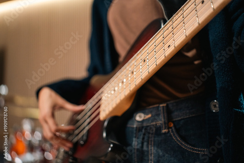 Photos Young asian music group Band members rehearse with instruments guitar bass drum