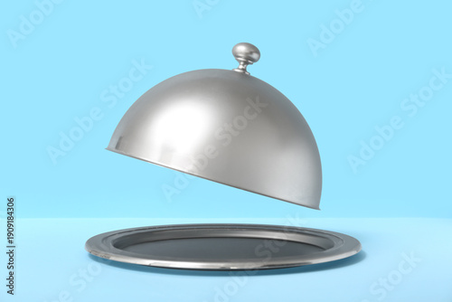 Silver tray with open cloch...