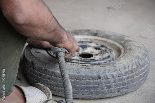 Manual Tire Inflation with Air Compressor Nozzle