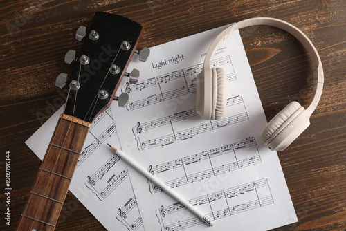 Music sheets, modern headph...