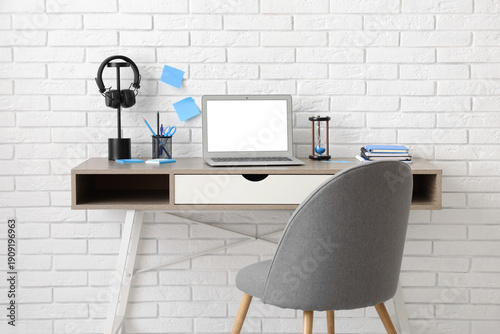 Stylish workplace with mode...