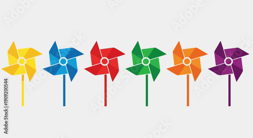 Colorful pinwheels arranged in a row against a white background.