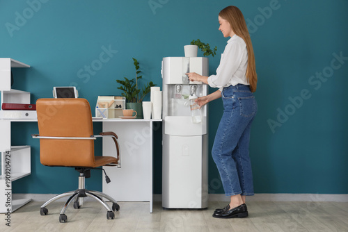 Businesswoman pouring water...