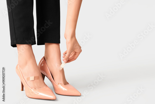 Young woman applying callus...
