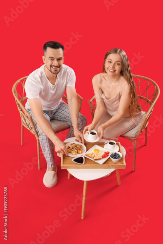 Young couple having breakfa...