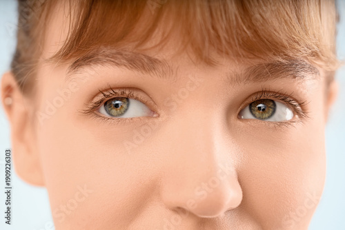 Young woman with green eyes...