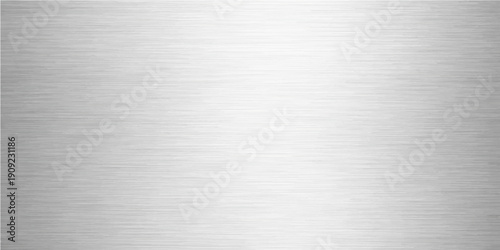 A seamless brushed metal texture features a silver stainless steel plate background with a shiny metallic surface pattern and grey aluminum sheet reflections for a modern industrial backdrop
