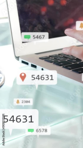 Vertical video: Pin popping, right hand tapping laptop keys, badges updating to show alerts