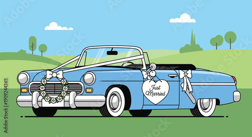 Decorated classic blue wedding car parked in a green field