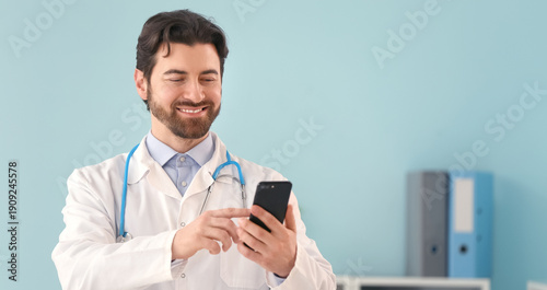 Young doctor using mobile p...