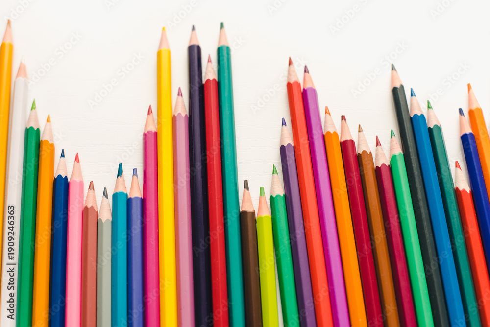Fototapeta premium Colored pencils on a white background. Background of multicolored pencils.