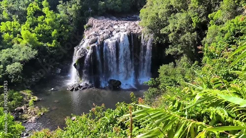Cascade at Bassin Nicole and Bassin Boeuf, Sainte Suzanne, la Reunion. Strong waterfall in lush tropical environment, during rainy season