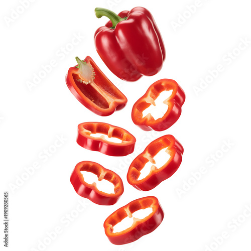 A vibrant whole red bell pepper with one half slice and several fresh ring pieces gracefully falling, isolated on transparent background