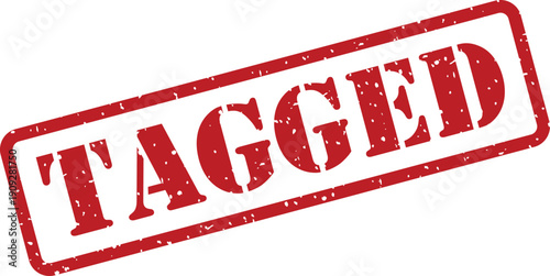 A bold red rectangular rubber stamp with a grunge texture displaying the word TAGGED diagonally on a white plane