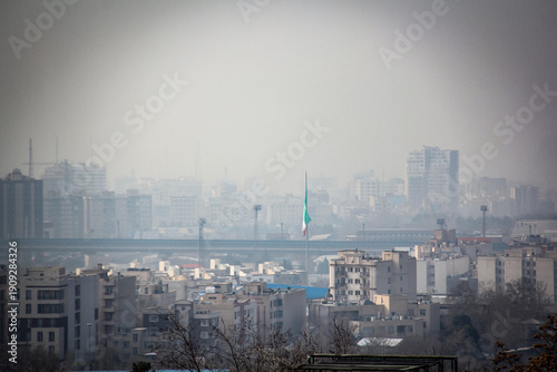 Wallpaper Mural View of northeast Tehran, where the Iranian flag is raised in the center of the photo. Torontodigital.ca