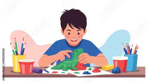 Creative young boy focused on molding a green dinosaur figure out of colorful clay on a table with art supplies.