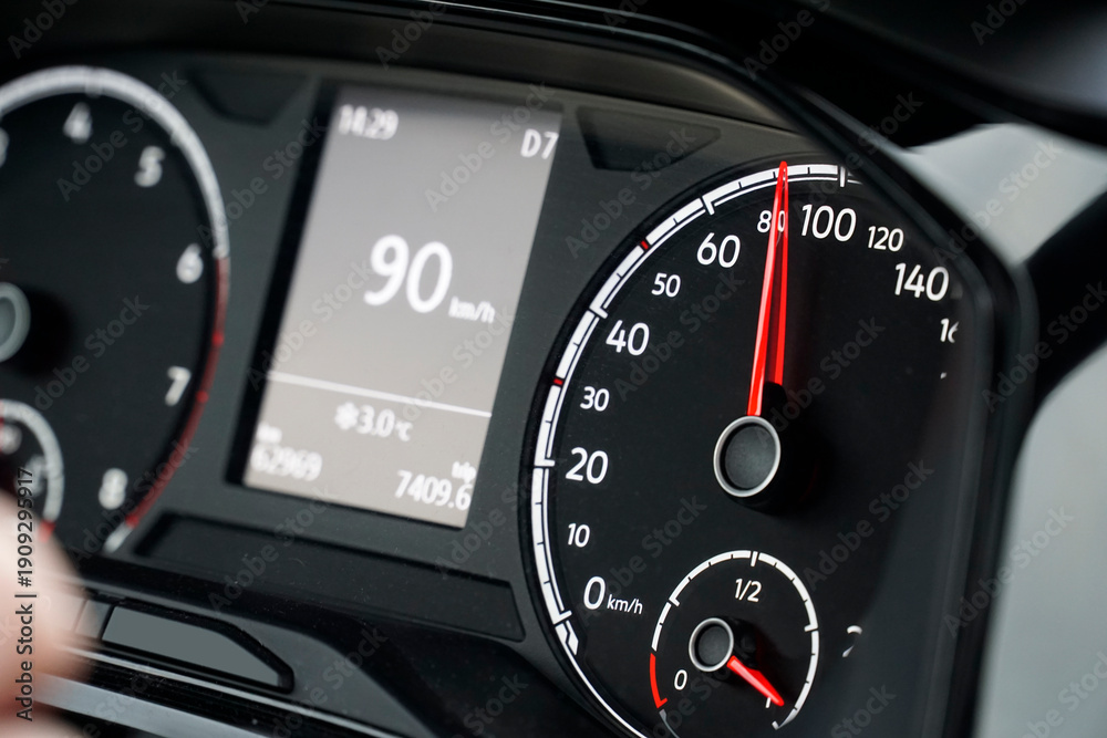 Fototapeta premium Digital Speedometer on the Dashboard Shows Current Speed