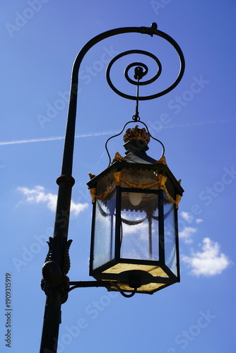 Decorative Street Lamp on Blue Sky Background