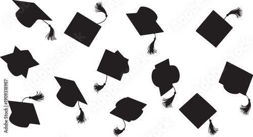 Graduation caps and tassels flying in the air celebrating