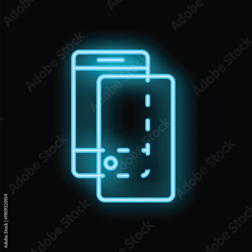 Neon sign is glowing in front of a black background, representing a smartphone paying contactless with a credit card
