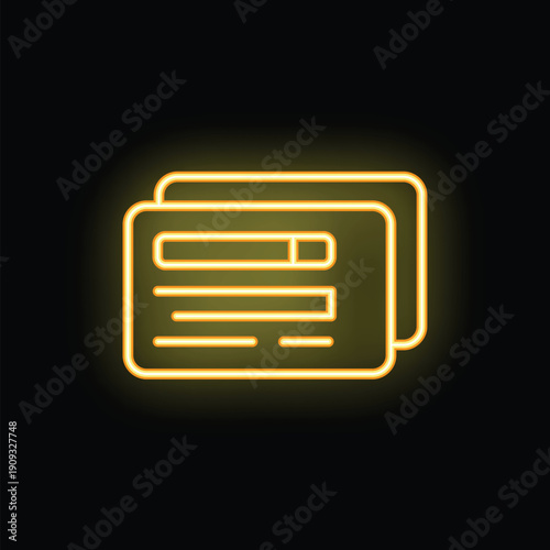 Bright yellow neon sign in the shape of two credit cards is glowing on a black background