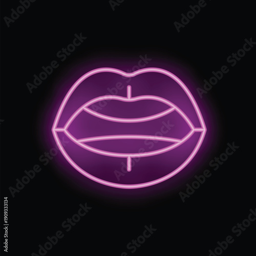 Neon sign showing a pair of female lips with the tongue sticking out on black background