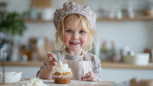 Child decorating cupcake happy kitchen