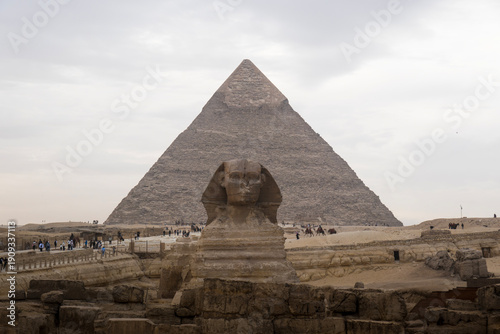 Cairo, Egypt- February 01, 2026: Majestic Great Sphinx and Pyramids with Traditional Desert Transport Sc