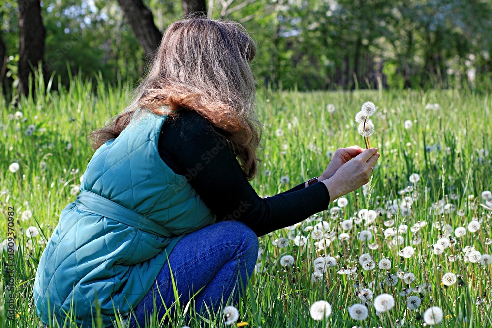 Fototapeta premium young woman lying on grass