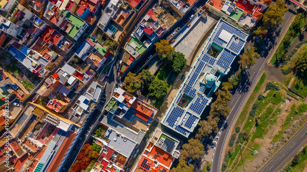 Fototapeta premium Symmetrical aerial perspective of modern building equipped with solar panels