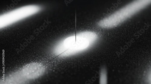 Dust particles illuminated by a bright light source in a dark room.