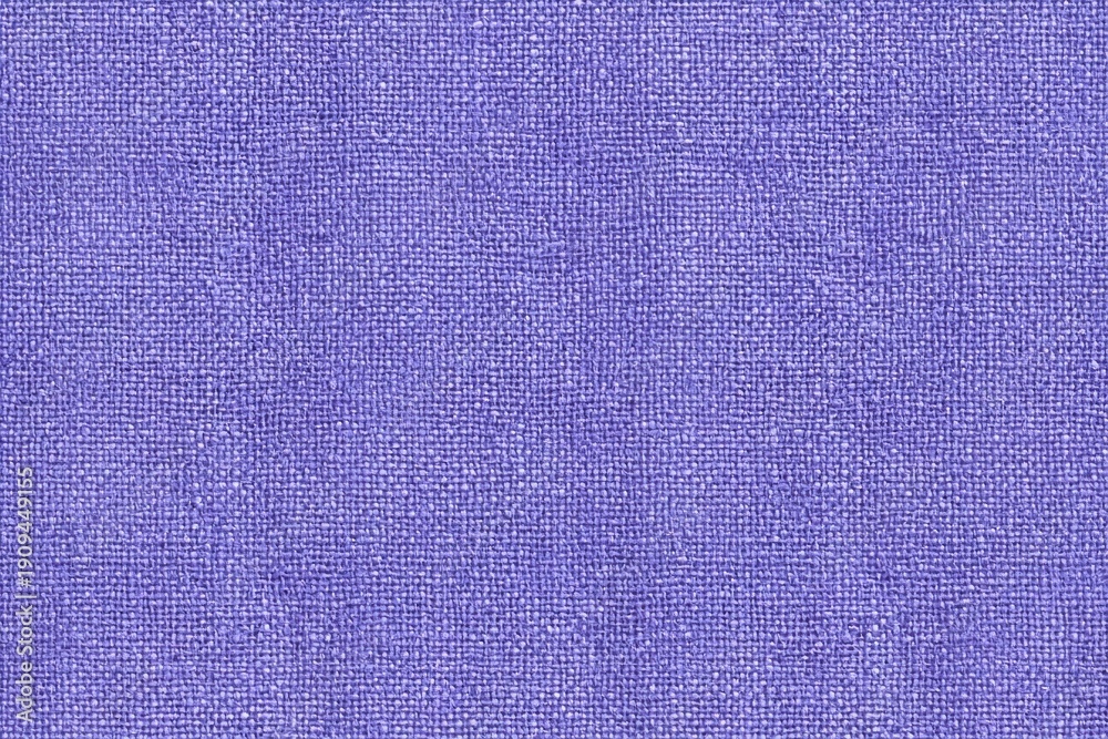 Fototapeta premium Purple fabric texture close up with visible weave pattern and soft textile surface for background or design use in textile and fashion industries.