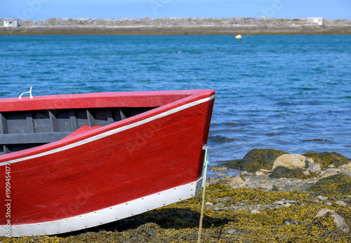 Red boat by the sea