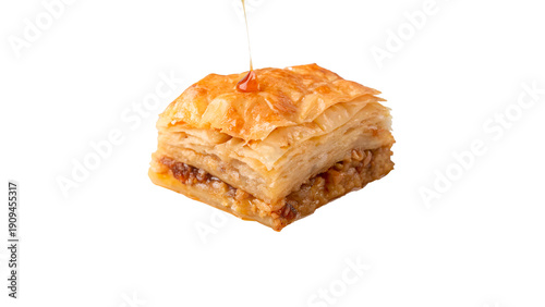 Tablou pe pânză Baklava dessert with honey drizzle on top isolated on transparent background cut