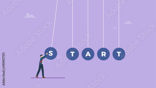 Businessman launches balls with the inscription start. Start-up concept, action and reaction or cause and result in business with cradle. Launching startup or new business project.