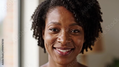 African American woman smiling with closed eyes expressing joy