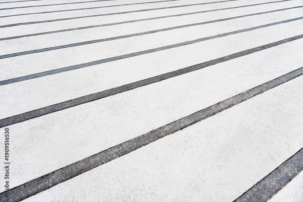Fototapeta premium White pedestrian crossing lines on the asphalt