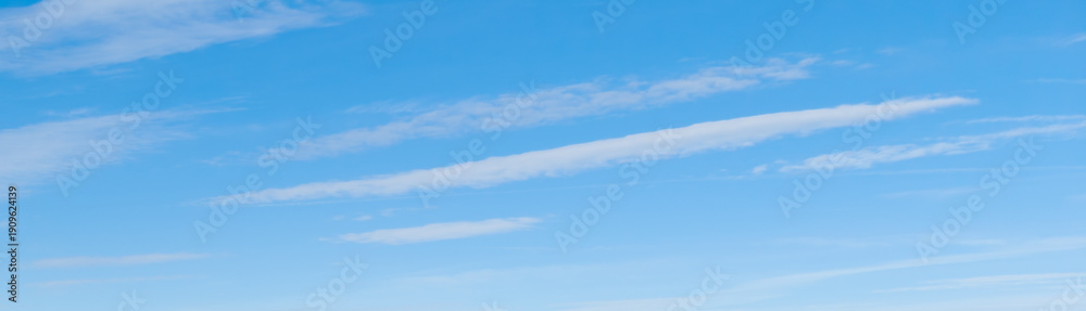 Fototapeta premium White cirrus clouds in the blue sky