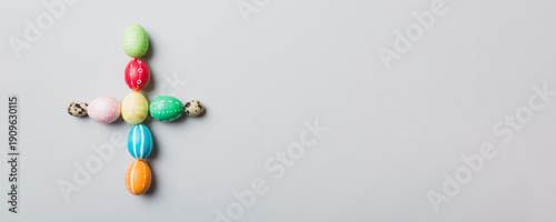 Wallpaper Mural holiday preparation Multi colors Easter eggs on colored background, cross show the religious and secular side of Easter. Pastel color Easter eggs. holiday concept with copy space Torontodigital.ca