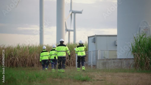 Engineers working on site in wind turbine farm, Wind turbines generate clean energy source, Eco technology for electric, industry environment, sustainable technology wind power maintenance.