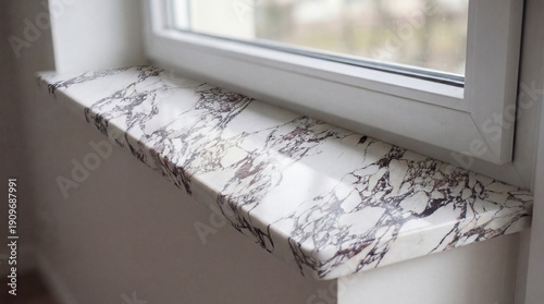 Bild auf Leinwand High-contrast marble window sill with bold natural stone patterns