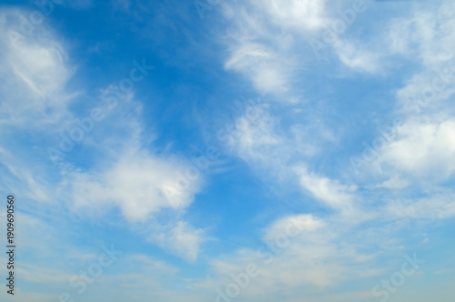 Fantastic soft white clouds against blue sky.