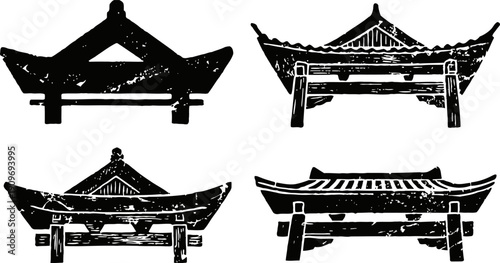 Silhouettes of traditional asian pagoda roofs with curved eaves and ornamental ridge decorations